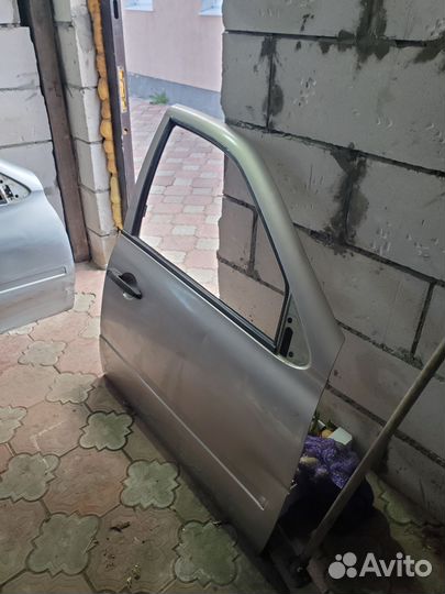 Дверь передняя правая на калину серебристый 2шт
