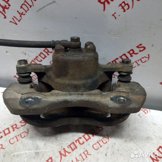 Суппорт тормозной передний Mitsubishi Outlander