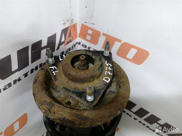 Амортизатор передний левый Митсубиси Лансер 10