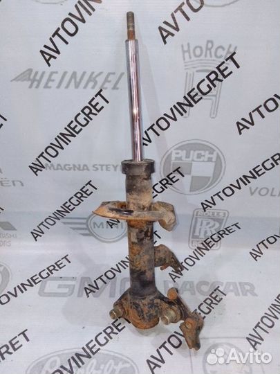 Стойка амортизатор передняя левая Nissan Primera