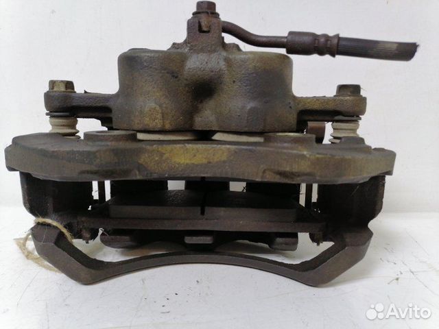 Суппорт тормозной передний правый Nissan Urvan E24