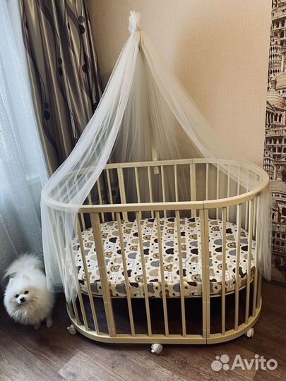 Детская кроватка с маятником