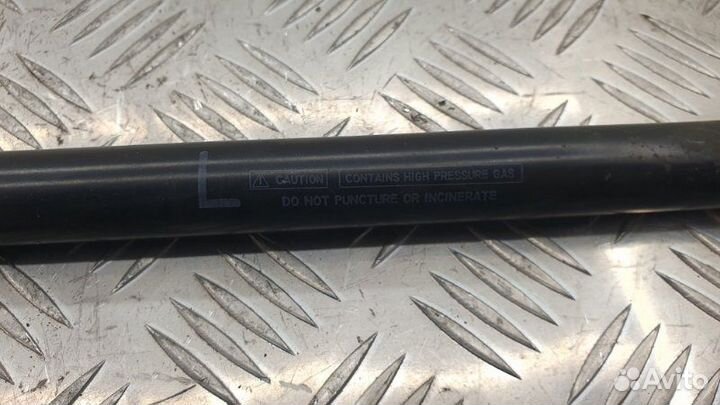 Амортизатор двери багажника задний левый Mazda