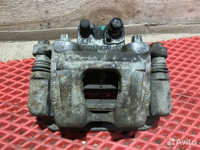 Суппорт тормозной задний левый Kia Quoris