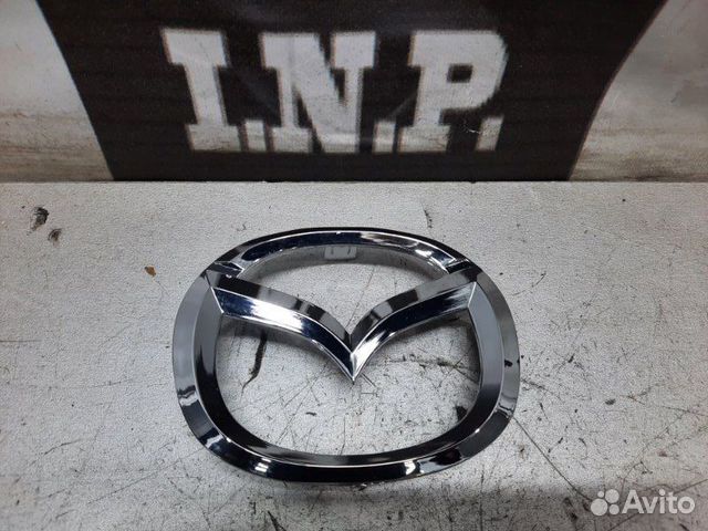 Эмблема передняя Mazda 3 Bk 2003-2006