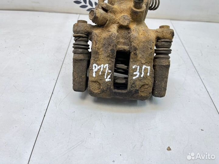 Суппорт задний правый Nissan Primera P11 1.6 GA16