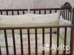 Детская кроватка с маятником