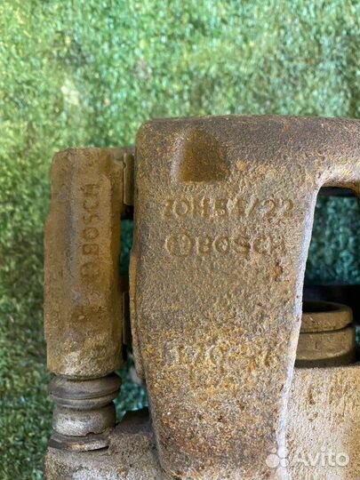 Суппорт тормозной передний левый Nissan Almera G15