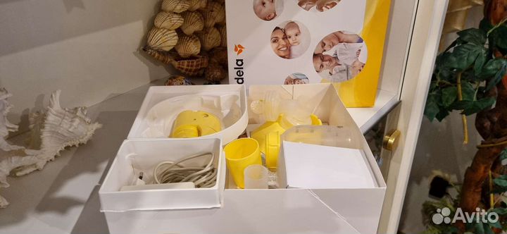 Молокоотсос medela электрический