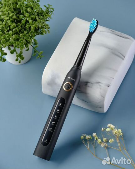 Электрическая зубная щетка