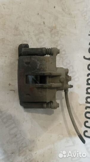 Суппорт передний левый Тойота Королла Е120