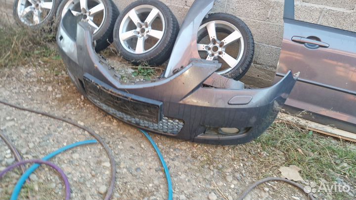 Передний бампер мазда 3 бк седан 2006 год