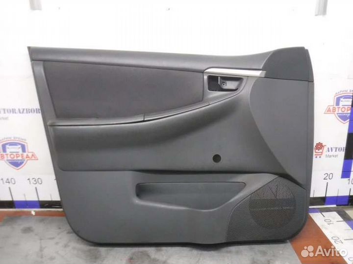 Обшивка двери передняя левая Toyota Corolla 124