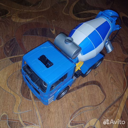 Машина игрушка Bruder бетономешалка MAN сине-серый
