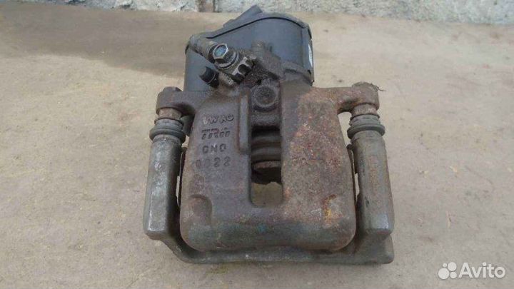 Суппорт тормозной задний правый Volkswagen Passat