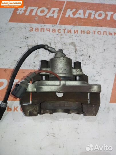 Суппорт тормозной передний левый Volkswagen Caddy