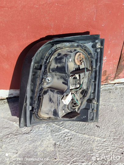 Фонарь левый Nissan March K11 1992-2002г