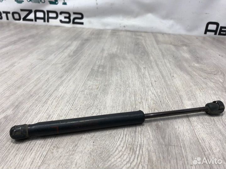 Амортизатор крышки багажника Mitsubishi Lancer 10