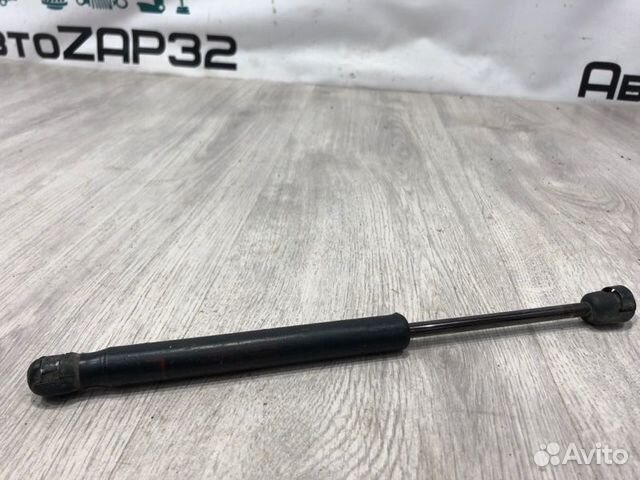 Амортизатор крышки багажника Mitsubishi Lancer 10