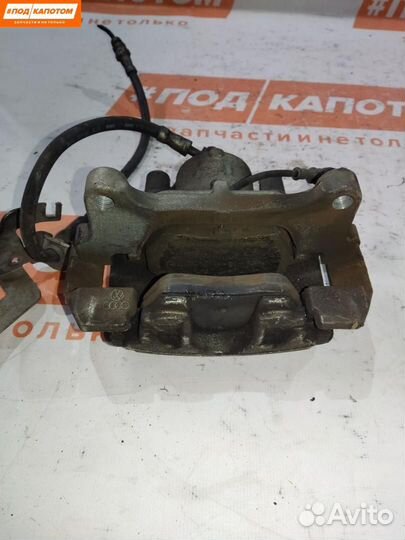 Суппорт тормозной передний левый Volkswagen Caddy