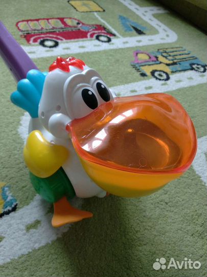 Свето-музыкальная игрушка каталка