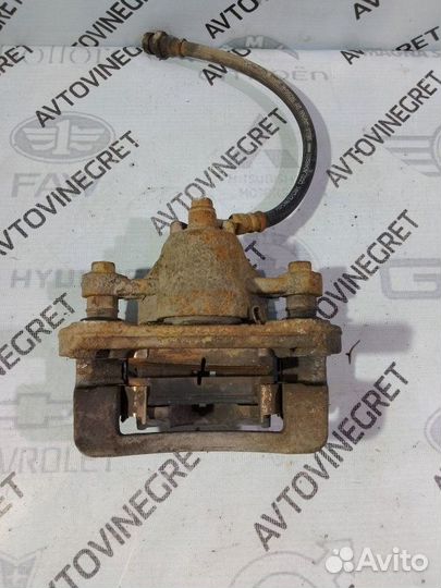 Суппорт тормозной задний Kia Cerato 1