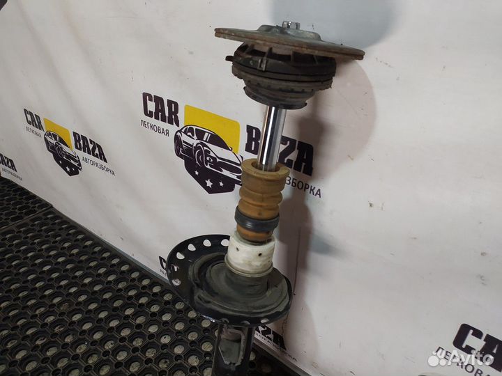 Стойка амортизатора передняя левая L