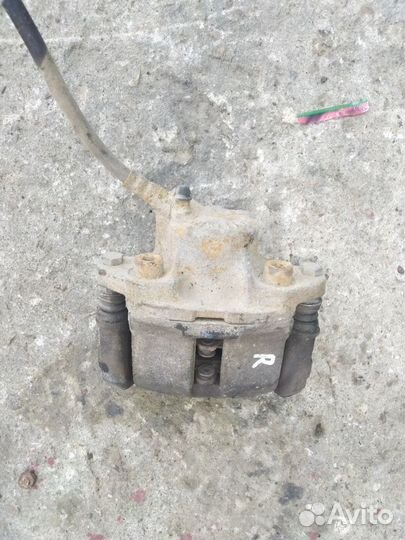 Тормозной суппорт передний правый Renault Logan