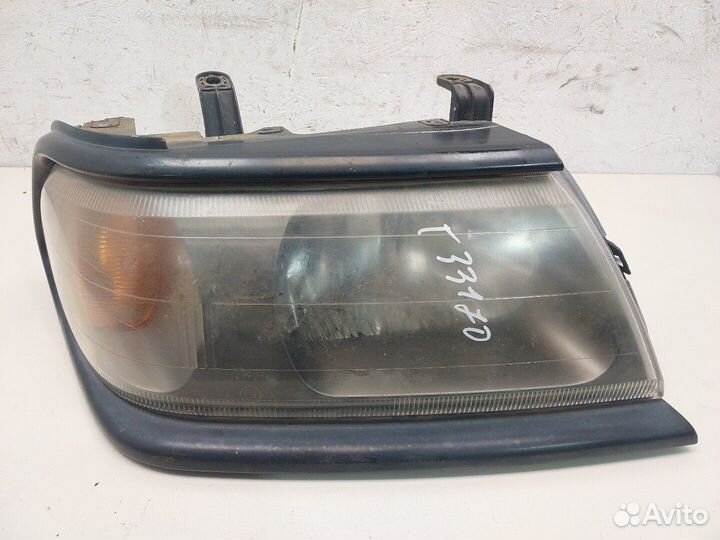 Фара (передняя) Mitsubishi Montero Sport / Pajero