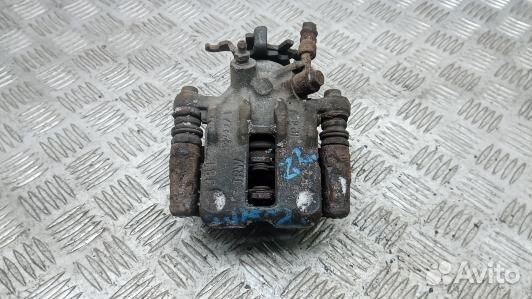 Суппорт тормозной задний левый nissan almera tino