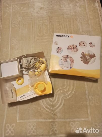 Молокоотсос medela электрический