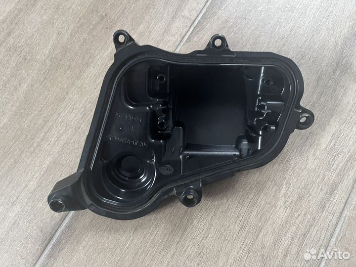 Крышка фары левая Hella 195120-01