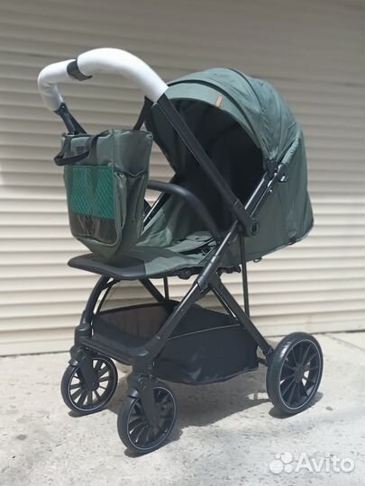 Коляска с большими колесами и перекидной ручкой
