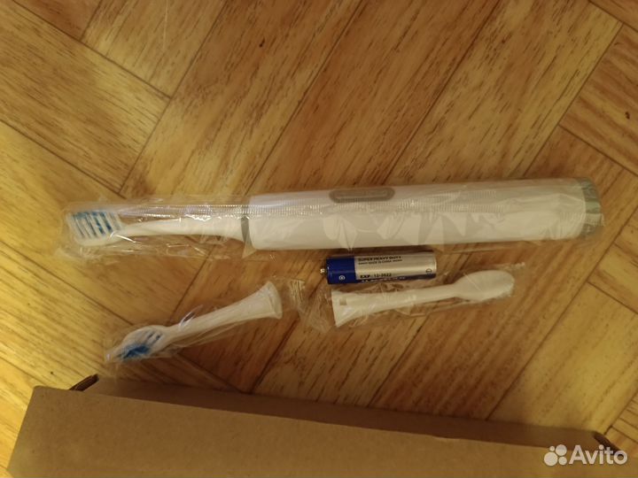 Электрическая зубная щетка