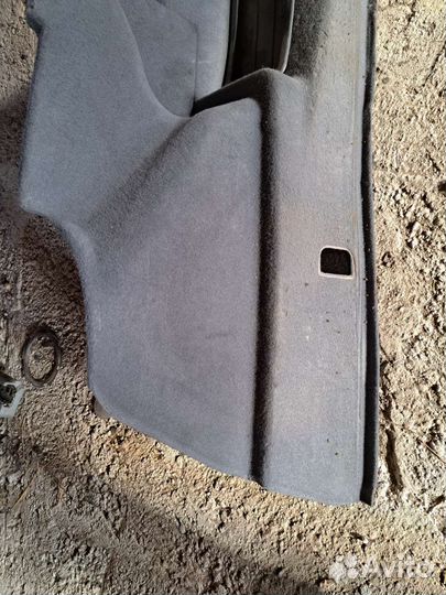 Обшивка багажника правая BMW F01