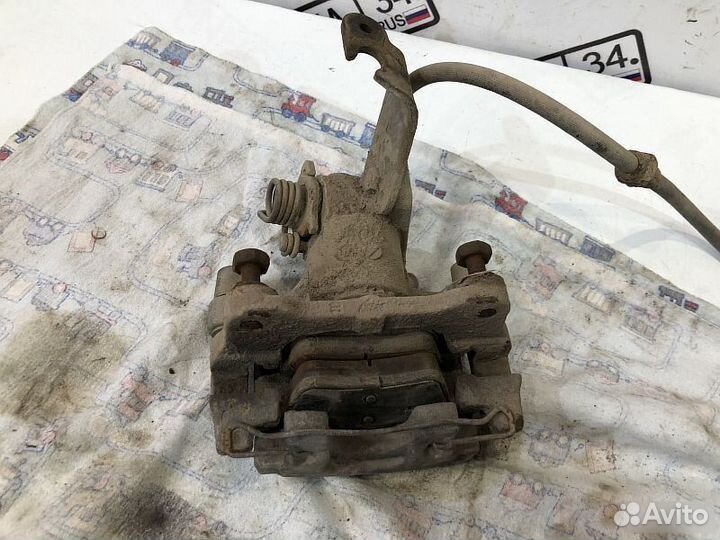 Суппорт задний правый Nissan Primera 12