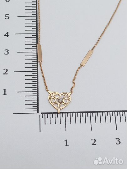 Золотое колье с камнем