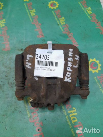 Суппорт передний левый Mitsubishi Carisma седан