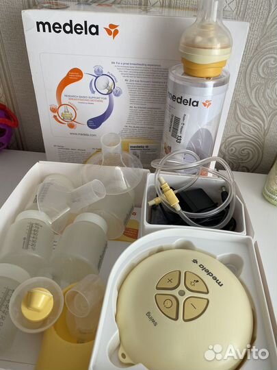 Молокоотсос medela электрический