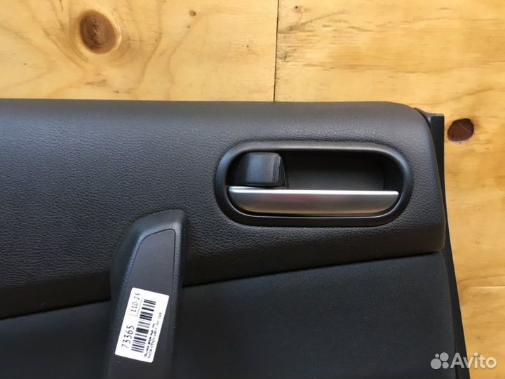 Обшивка двери лев. зад. mazda atenza