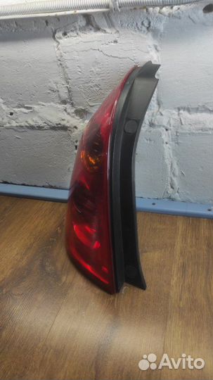 Фонарь заднего хода задний левый Nissan Primera P