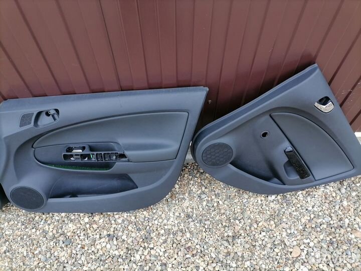 Opel Corsa D обшивки дверей