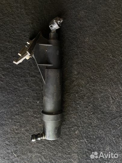 Форсунка омывателя фар левая Nissan Almera N16