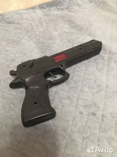 Детские игрушки пистолет