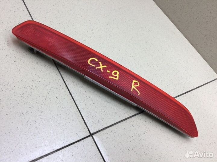 Отражатель в бампер задний правый Mazda Cx 9