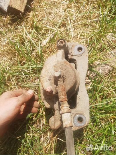 Суппорт передний левый на мазда 323