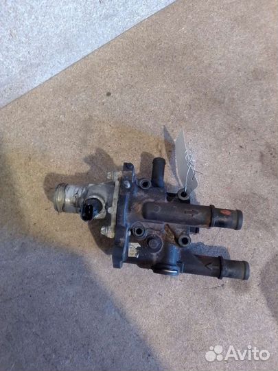 Корпус термостата Opel Astra H Zafira B 1.8-1.6,л