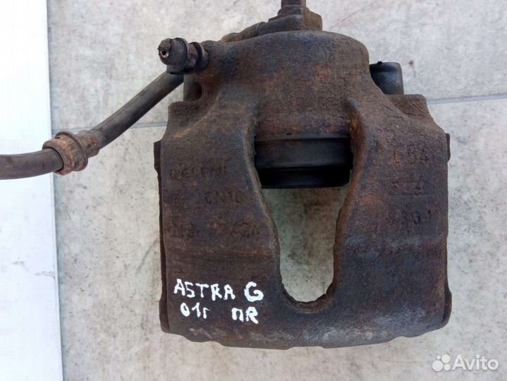 Суппорт тормозной передний правый Opel Astra G