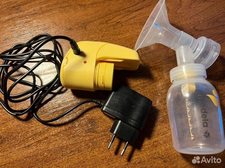 Молокоотсос medela электрический