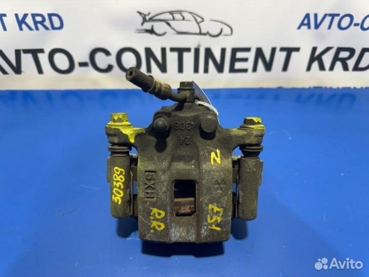 Суппорт тормозной задний правый Nissan Elgrand E51